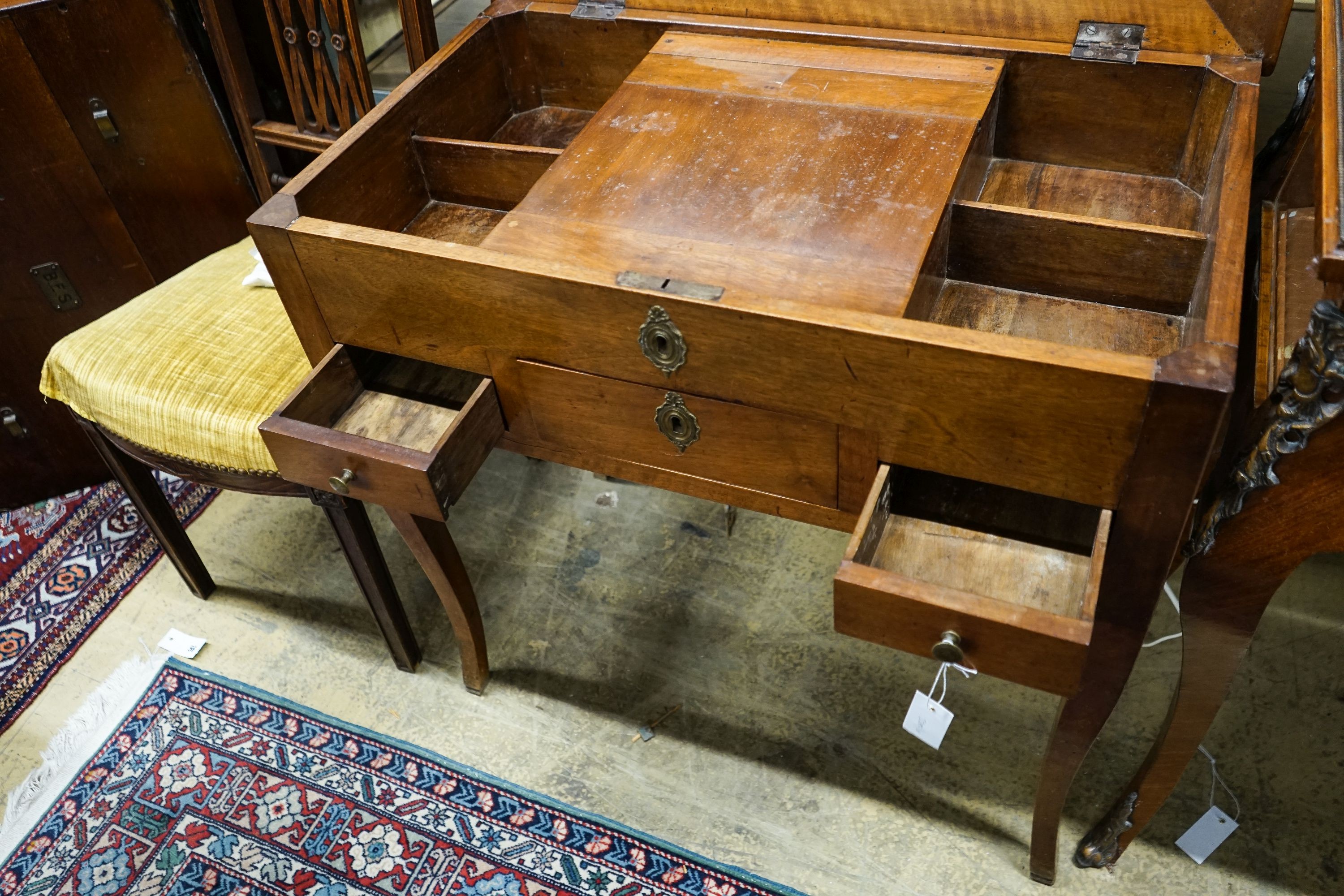 A 19th century French fruitwood enclosed dressing table with rectangular hinged top, width 78cm, depth 45cm, height 76cm